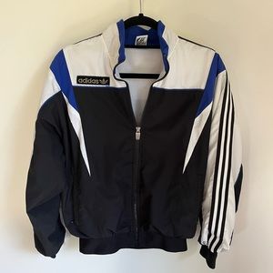 Vintage black, white, and blue adidas full zip windbreaker size large.